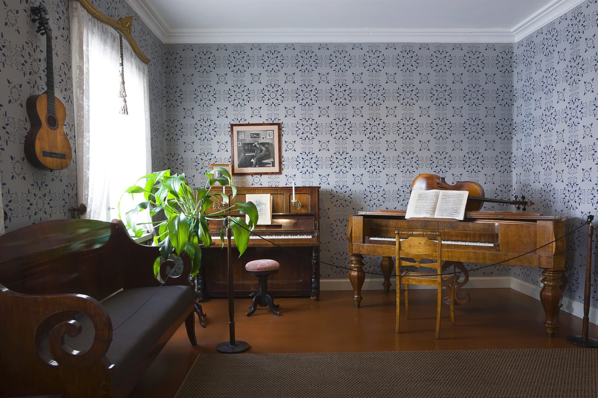 A room in a birthplace of Jean Sibelius. Different instruments and an old sofa.