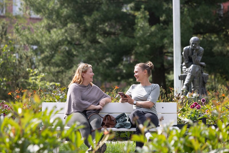 Ladies sitting at the park bench