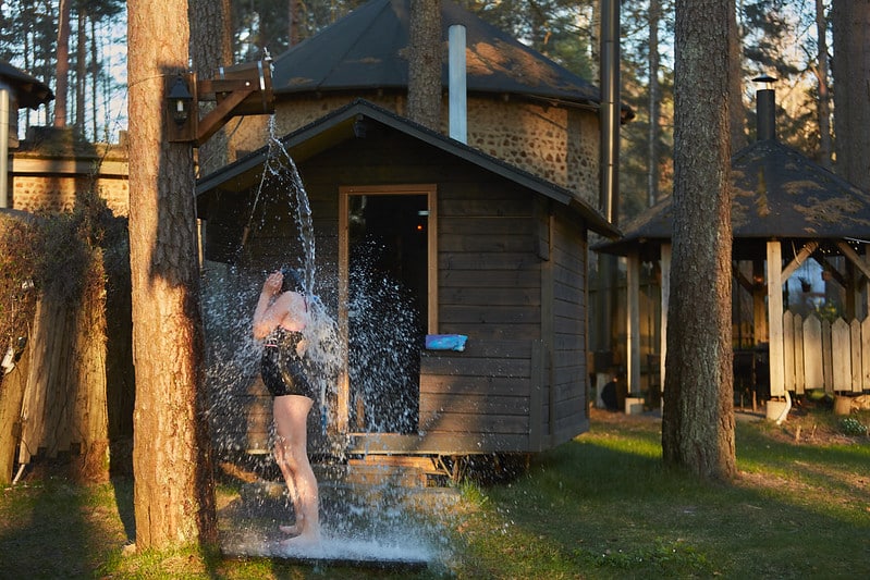 A women taking a shower outside